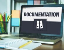 Documentation displayed on a laptop computer. Document all changes - My Project Management Lessons