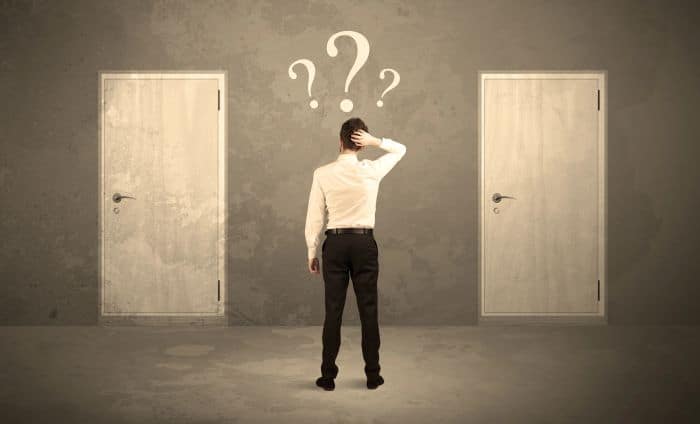 Man choosing which door to enter - How to choose a company to work for - myprojectlessons.com